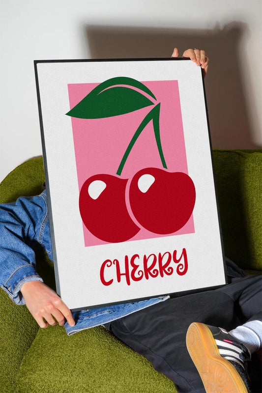 Pembe arka plan üzerinde iki kırmızı kiraz ve yeşil yaprakları olan modern çerçeveli poster