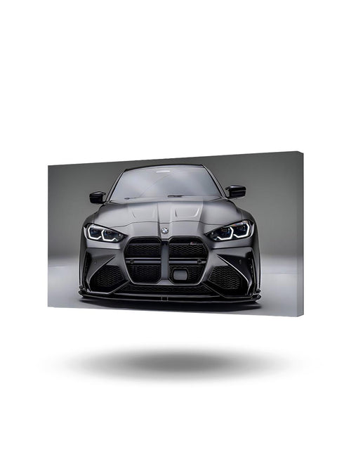 Gri renkli BMW M4 spor otomobilin detaylı ön cephesini gösteren büyük kanvas tablo, modern çalışma alanında.