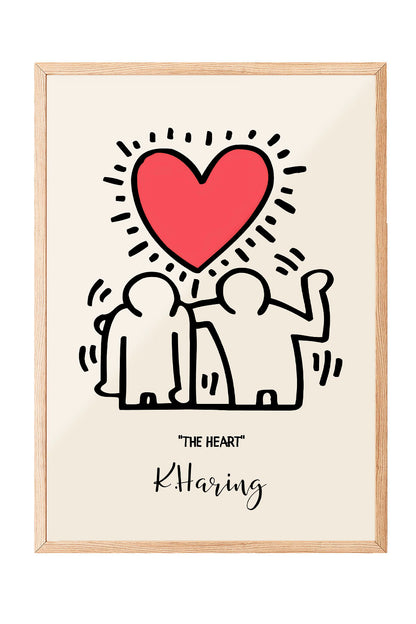 Siyah çerçeveli, bej zeminli, Keith Haring tarzı iki insan figürü ve parlak kırmızı kalp içeren modern sanat posteri.