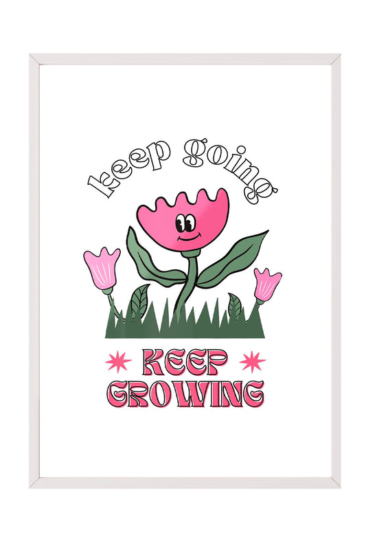Siyah çerçeveli, beyaz zeminde pembe gülen çiçek, küçük çiçekler ve çimenler ile 'Keep Going' ve 'Keep Growing' yazılı motivasyon posteri.