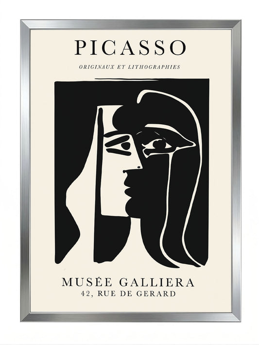 Siyah çerçeveli, bej arka plan üzerinde Picasso'nun soyut siyah beyaz kadın yüzü çizimi posteri.
