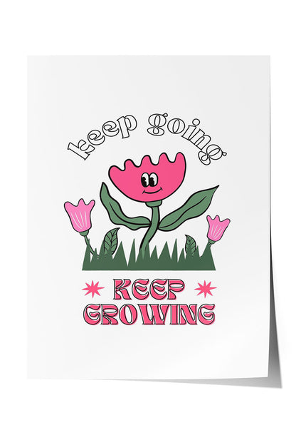 Siyah çerçeveli, beyaz zeminde pembe gülen çiçek, küçük çiçekler ve çimenler ile 'Keep Going' ve 'Keep Growing' yazılı motivasyon posteri.