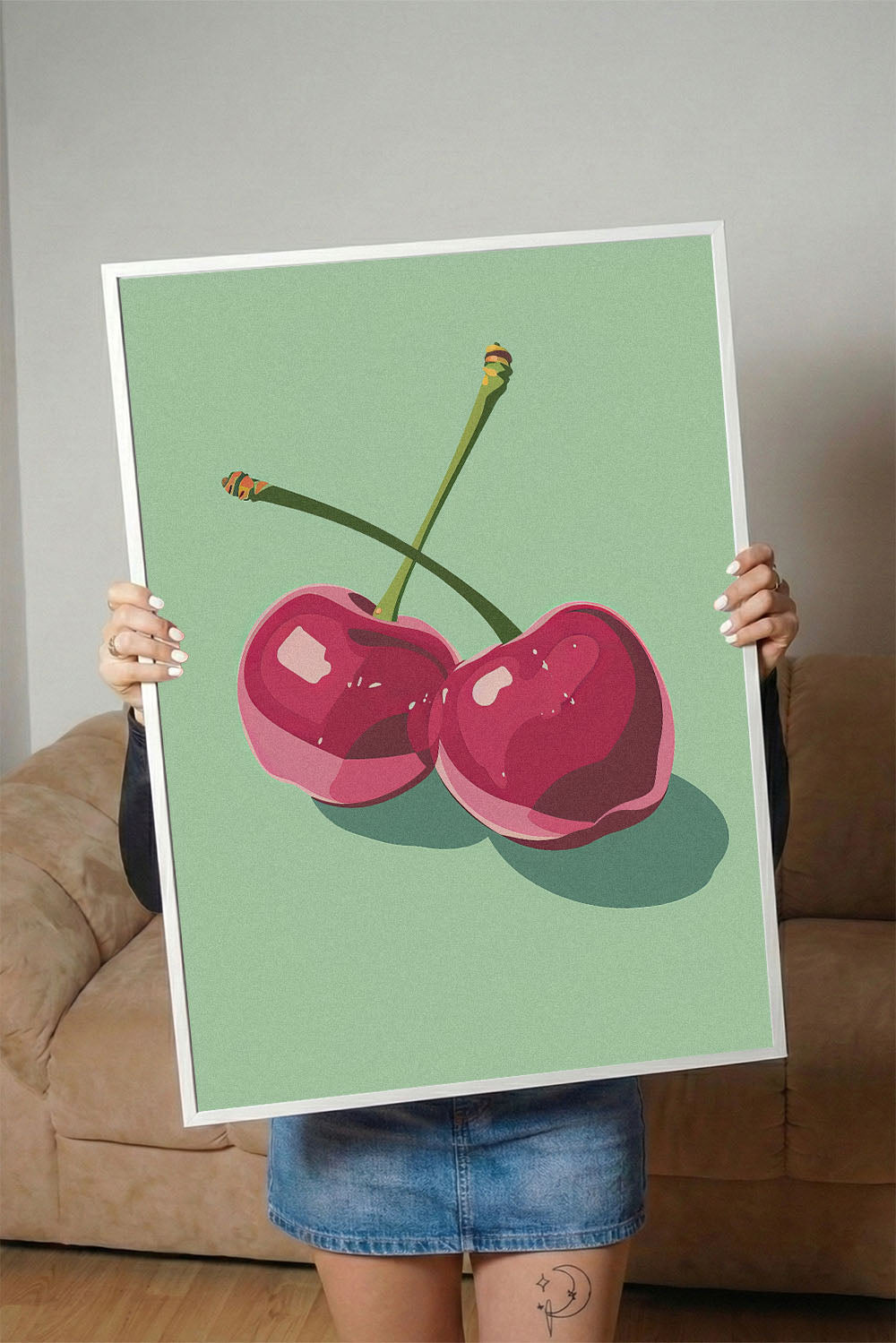 Siyah çerçeveli, açık yeşil fonda iki adet stilize pembe kiraz desenli modern poster.